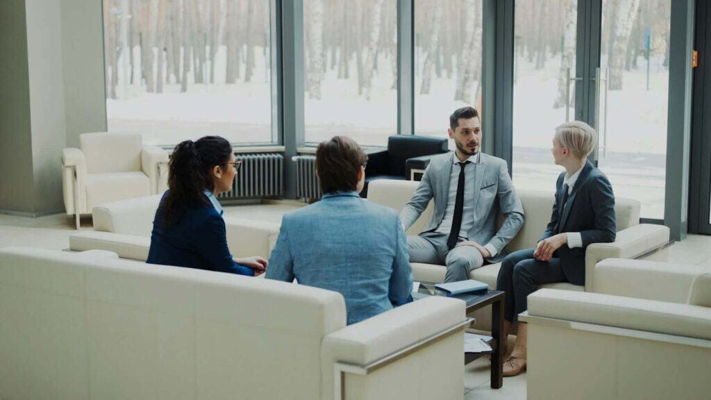 Group of business professionals meeting in a modern corporate office